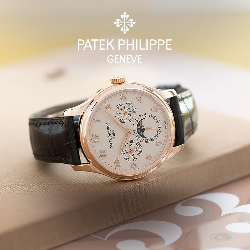 Patek Philippe watch with detailed face on a light background