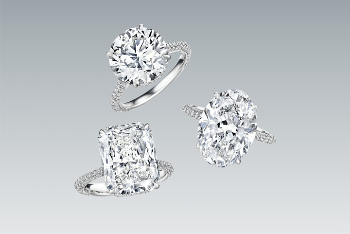 3 platinum diamond engagement rings with side stones floating