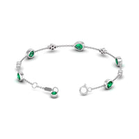 18K White Gold Pear Shaped Emerald and Round Diamond Cluster Bracelet