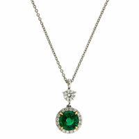 Platinum Emerald and Diamond Halo Pendant