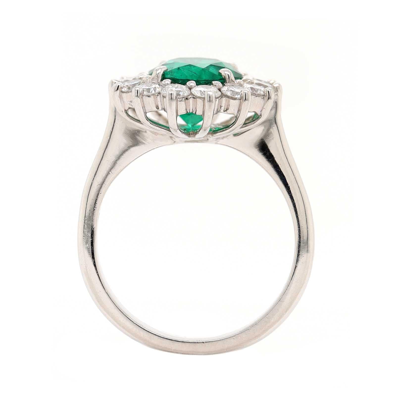 Platinum Round Emerald and Diamond Halo Ring