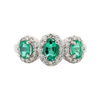 Platinum 3 Stone Oval Emerald and Diamond Halo Ring