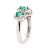 Platinum 3 Stone Oval Emerald and Diamond Halo Ring