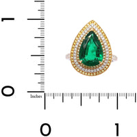 Platinum and 18K Yellow Gold Pear Shaped Emerald and Diamond Halo Ring