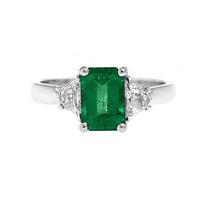 Platinum 3 Stone Emerald and Cadillac Diamond Halo Ring