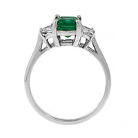 Platinum 3 Stone Emerald and Cadillac Diamond Halo Ring