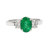 Platinum 3 Stone Oval Emerald and Diamond Halo Ring