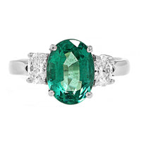 Platinum 3 Stone Oval Emerald and Diamond Ring