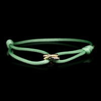 Cartier 18K Tricolor Gold Estate Trinity Bracelet on Green Silk Cord