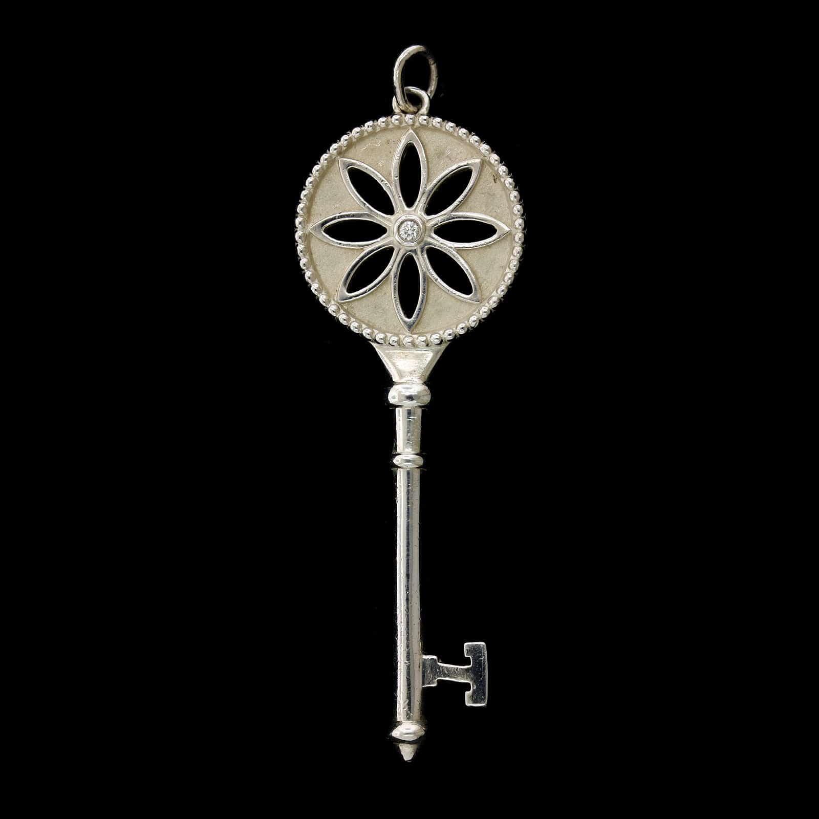 Tiffany & Co. Sterling Silver Estate and Diamond Daisy Key Pendant