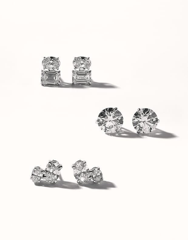 Set of diamond earrings on a white background