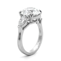 Platinum 3 Stone Round and Pear Shaped Diamond Engagement Ring