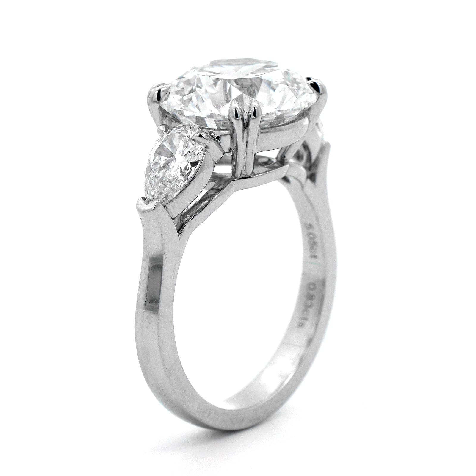 Platinum 3 Stone Round and Pear Shaped Diamond Engagement Ring