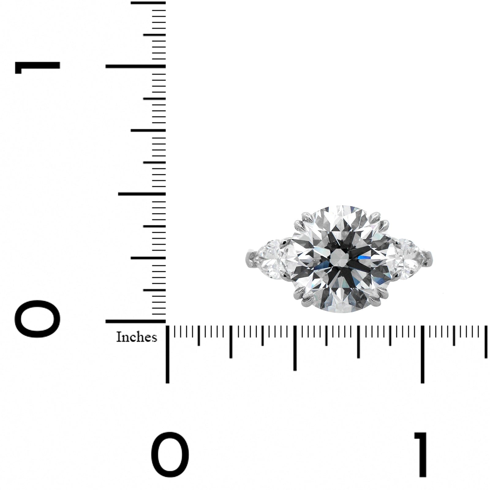 Platinum 3 Stone Round and Pear Shaped Diamond Engagement Ring