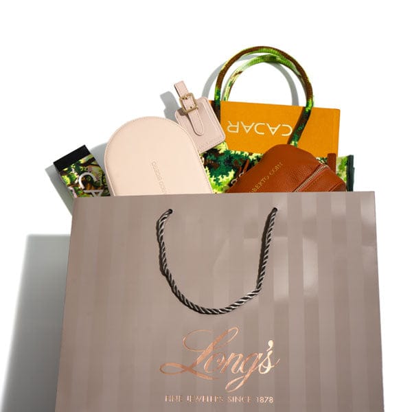 Shopping bag with 'Long's' branding and various handbags inside on a white background