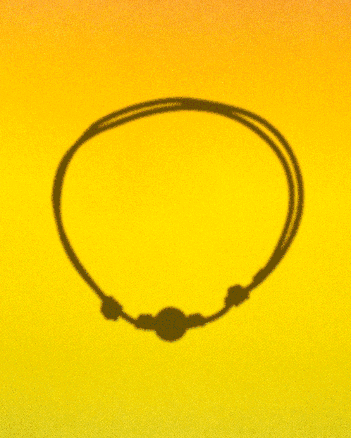 Pride bracelet shadow on rainbow background