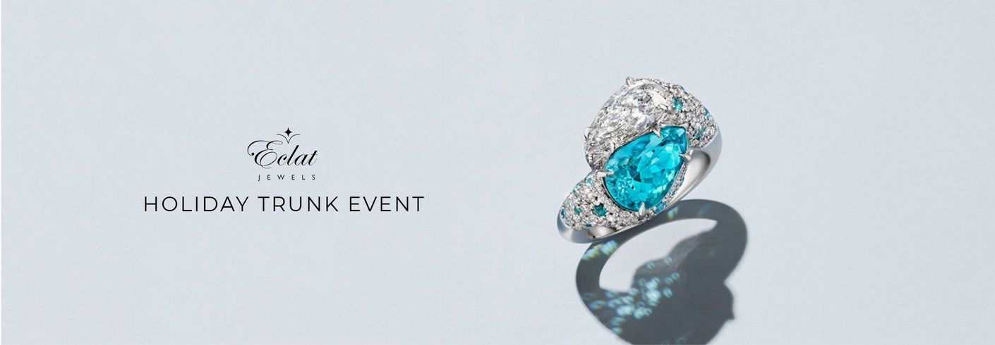 Jewelry ring with blue gemstone on a light gray background, featuring the brand 'Eclat'.