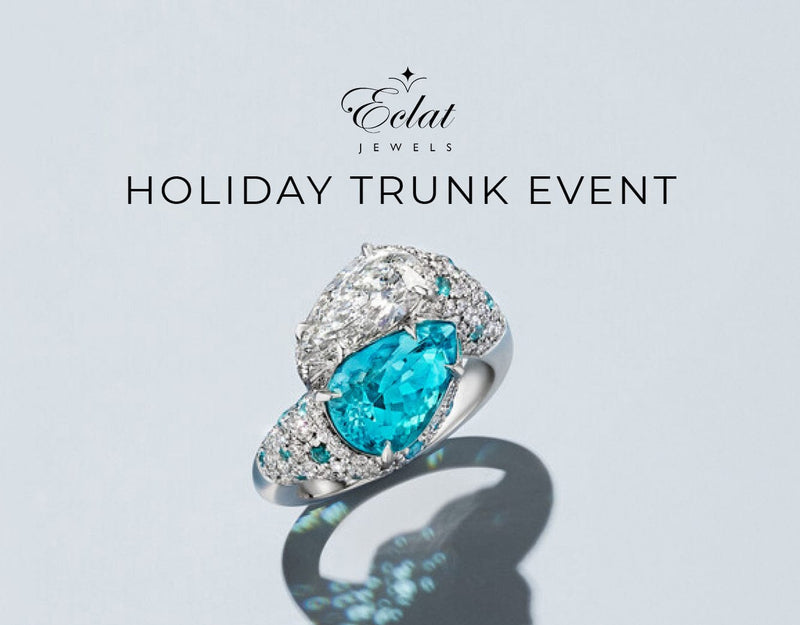 Teal gemstone ring with diamonds on a light gray background, featuring Eclat Jewels branding.