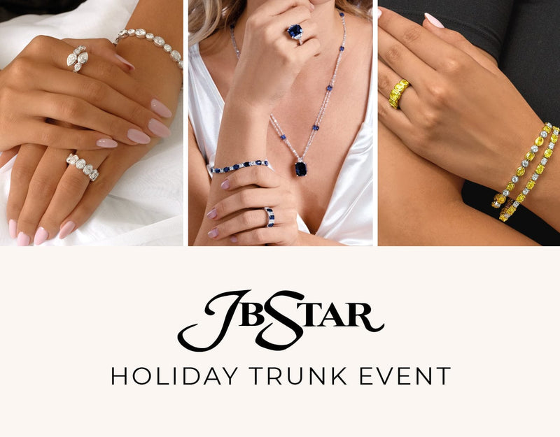 JB Star jewelry display with rings, bracelets, and necklaces on hands against a white background.