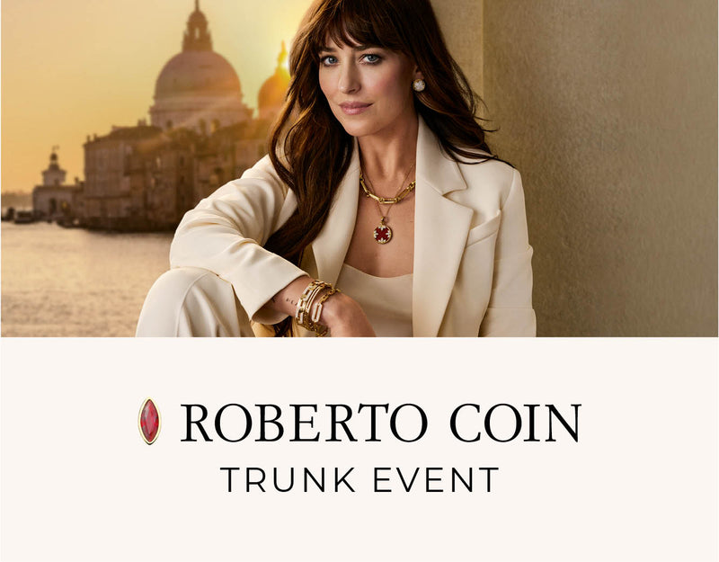 Dakota Johnson wearing jewelry with a scenic background, featuring Roberto Coin branding.