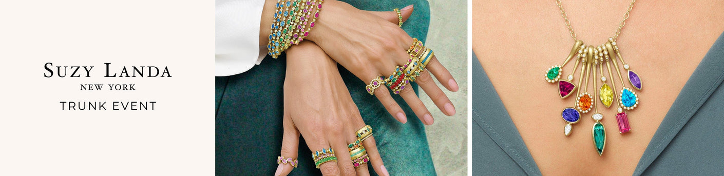 Colorful jewelry set including rings and a necklace displayed on a person, with 'Suzy Landa' branding.