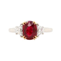 Platinum and 18K Yellow Gold Oval Ruby & Trap Cut Diamond Three Stone Ring