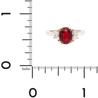 Platinum and 18K Yellow Gold Oval Ruby & Trap Cut Diamond Three Stone Ring