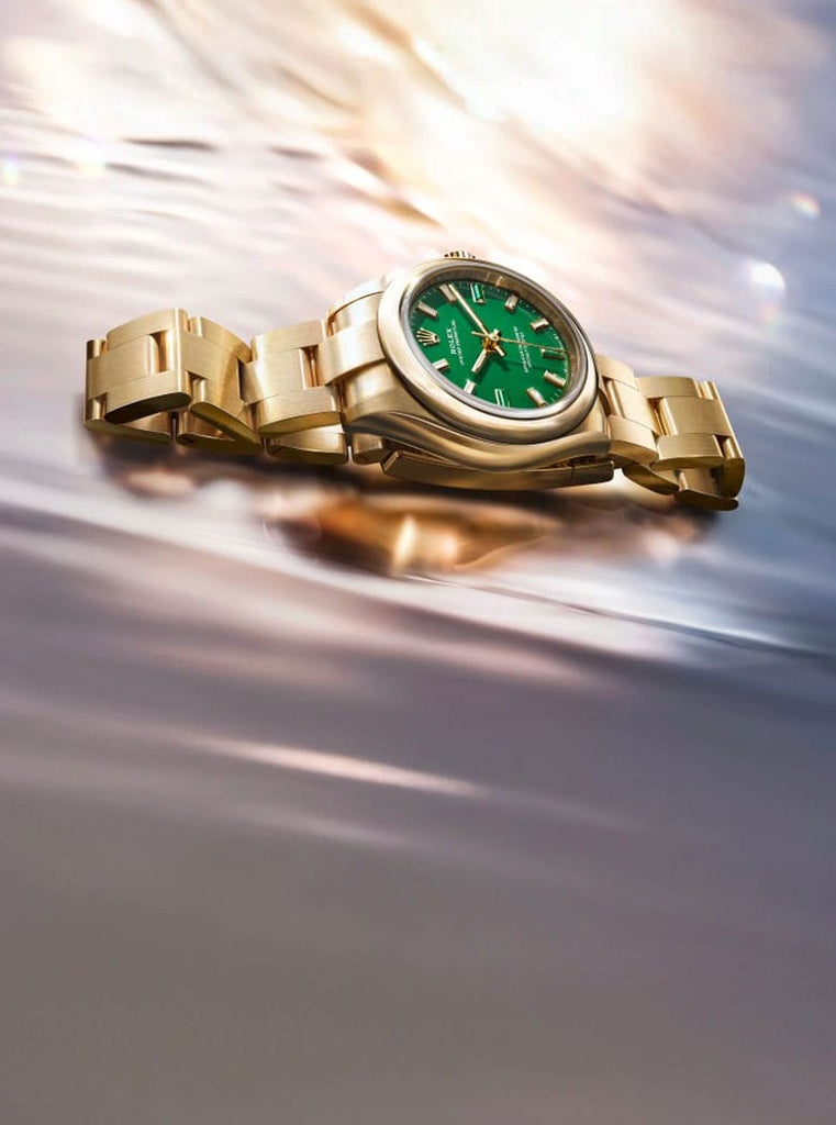 Rolex Oyster Perpetual Watch with Green Face on Water Surface