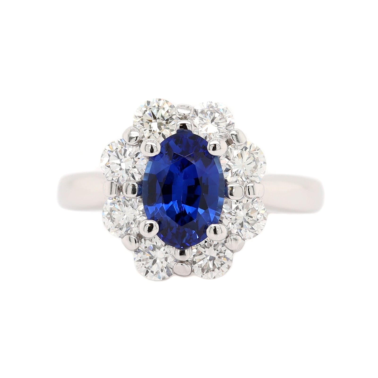 Platinum Oval Sapphire and Diamond Halo Ring