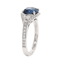 Platinum Three Stone Cushion Shaped Blue Sapphire and Diamond Halo Ring