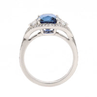Platinum Three Stone Cushion Shaped Blue Sapphire and Diamond Halo Ring