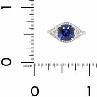 Platinum Three Stone Cushion Shaped Blue Sapphire and Diamond Halo Ring