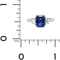 Platinum Three Stone Emerald Cut Sapphire and Cadillac Diamond Ring