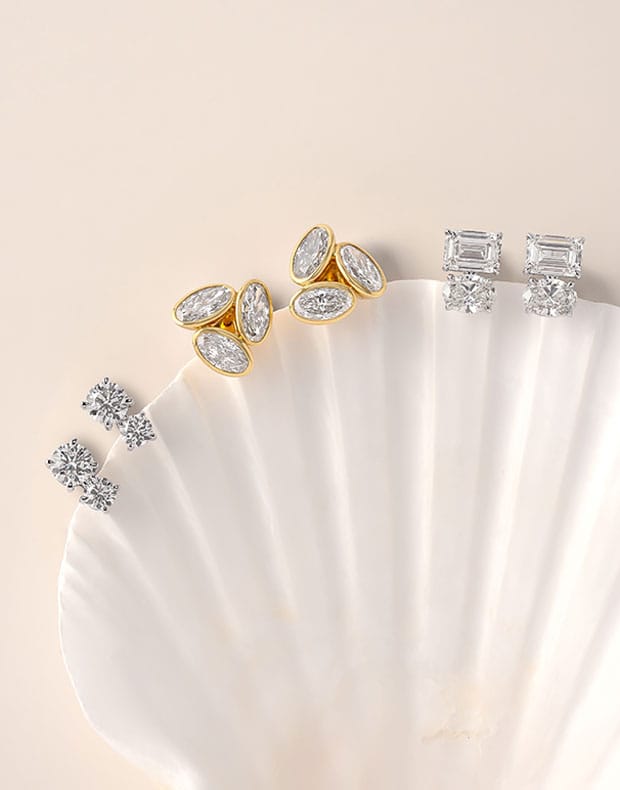 Diamond earrings on a shell