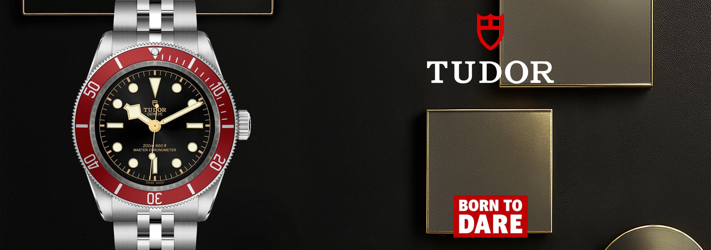 Tudor watch with red bezel on a black background, featuring the Tudor logo.