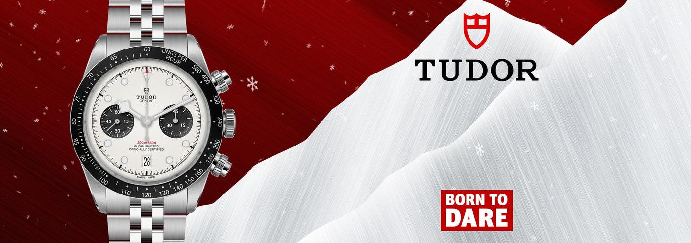 Tudor watch on a snowy mountain with red background