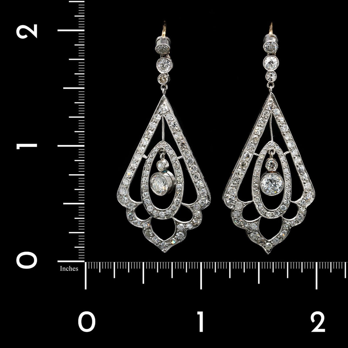 Bez Ambar blaze cut and round brilliant cut diamond earrings in platinum. |  AHEE Jewelers