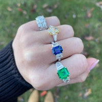 Platinum Emerald Ring with Emerald Cut Diamond Sides