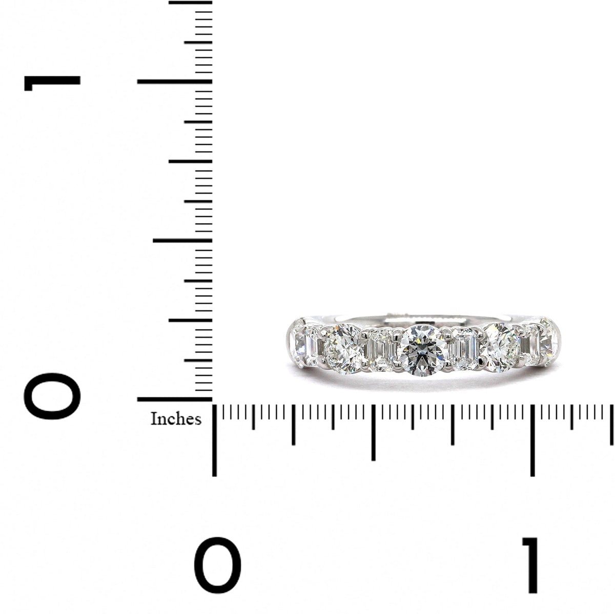 Platinum Emerald and Round Cut Diamond Band