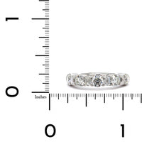Platinum Emerald and Round Cut Diamond Band
