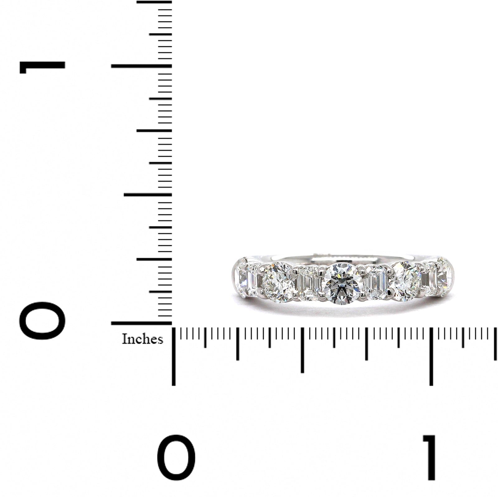 Platinum Emerald and Round Cut Diamond Band