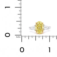 Platinum and 18K Yellow Gold 3 Stone Fancy Yellow Diamond Ring