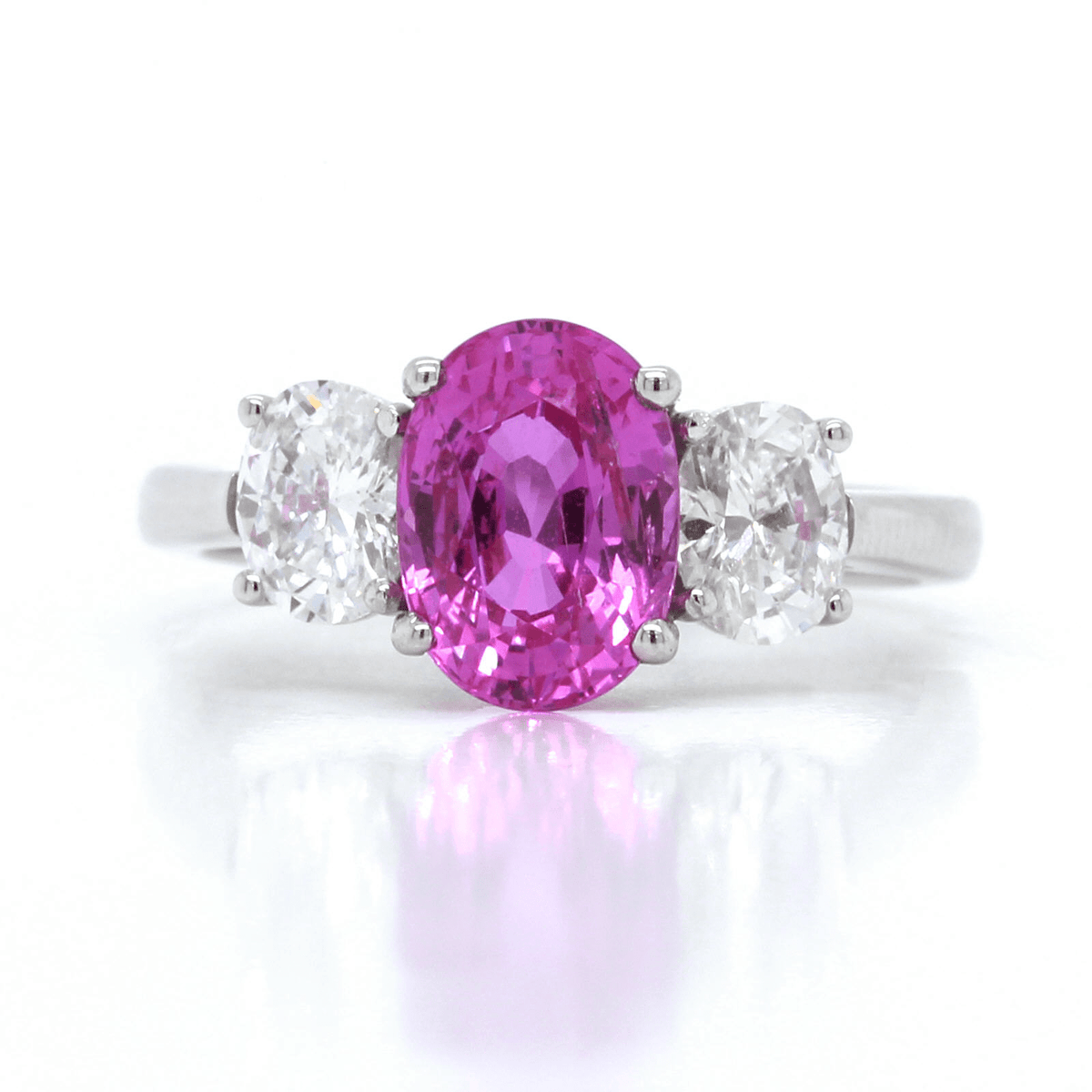 Platinum Three-Stone Oval Pink Sapphire and Diamond Ring